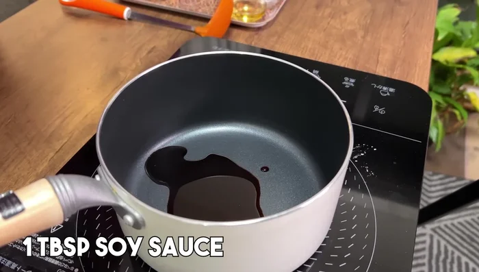 Prepare Kake Udon soup: In a pot, combine soy sauce, salt, mirin, and dashi stock. Bring to a boil, then turn off the heat.