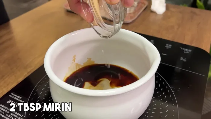 Prepare Kamaage Udon dipping sauce: In a pot, combine soy sauce, mirin, and dashi stock. Bring to a boil to evaporate alcohol. Transfer to a small bowl.