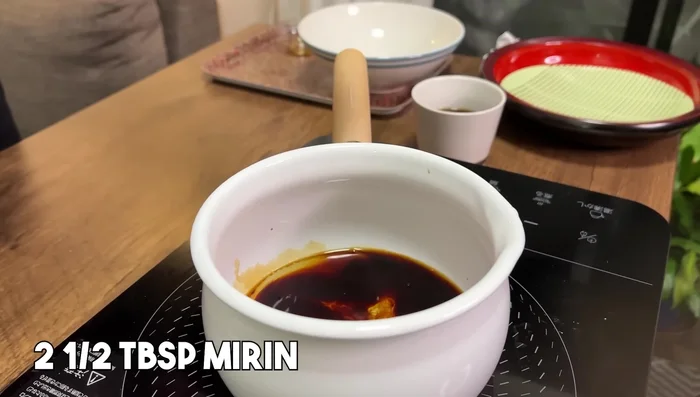 Prepare Bukkake Udon sauce: In a small saucepan, combine soy sauce, mirin, and dashi stock. Bring to a boil. Chill.