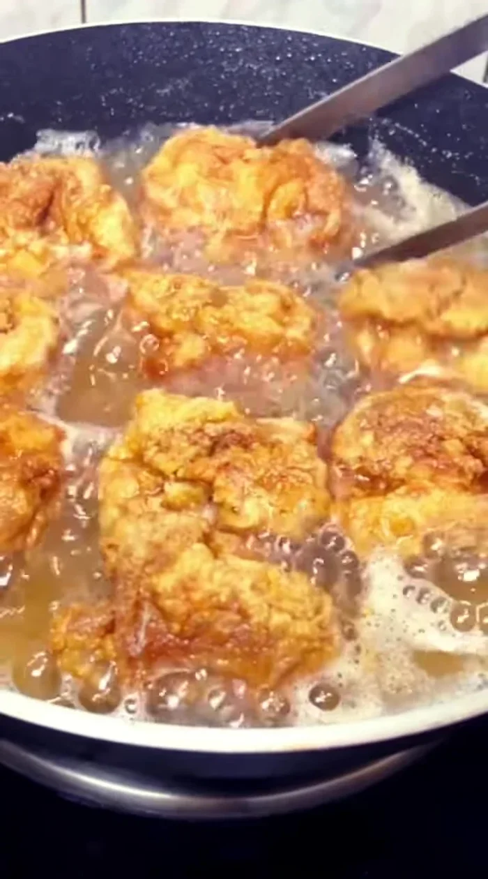 Reheat the oil to 180°C (356°F) and fry the chicken again until crispy.