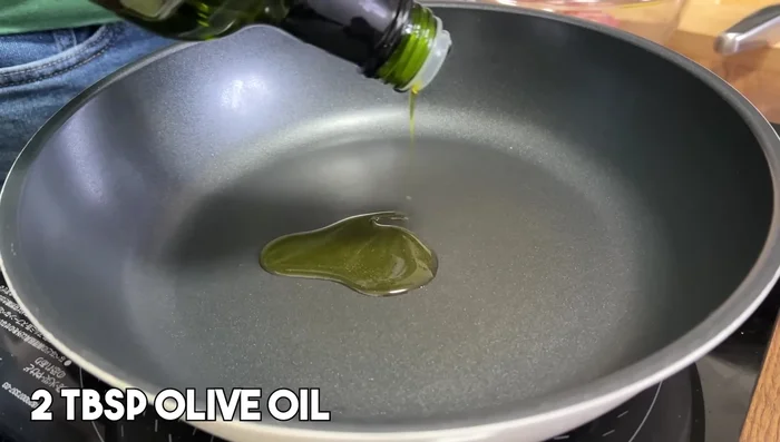 Sauté ginger and garlic in olive oil until lightly browned. Transfer to a plate, leaving the oil in the pan.