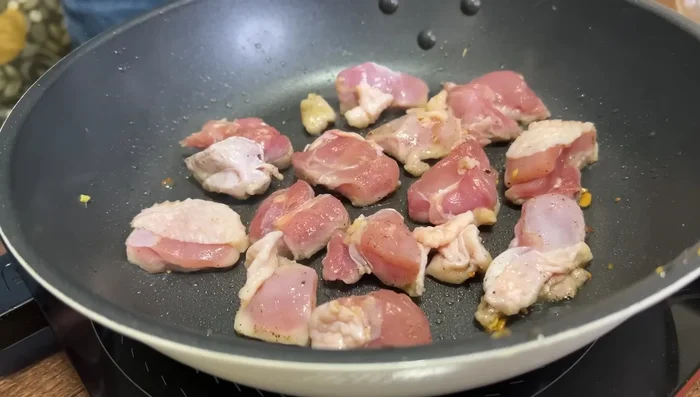 Cook chicken in the same pan until golden brown on both sides. Transfer to a plate.