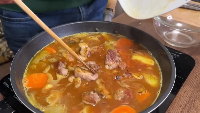 Add chicken and ginger-garlic mixture. Bring to a boil again, remove any scum. Reduce heat, cover, and simmer for about 20 minutes until vegetables are tender.
