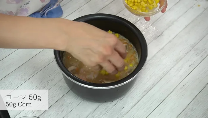 Add corn. Cook the rice according to your rice cooker's instructions. [418.68]