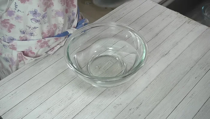 Transfer the mochi to a bowl of water to cool slightly.