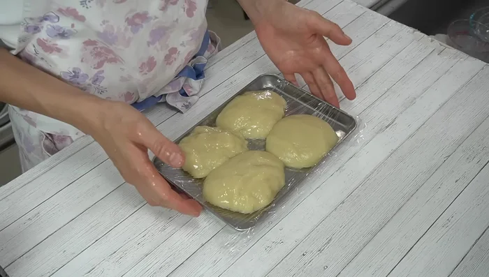 Place the mochi pieces on a tray lined with plastic wrap.