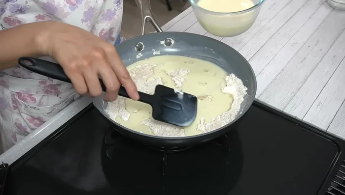 Gradually add soy milk, mixing well until smooth.