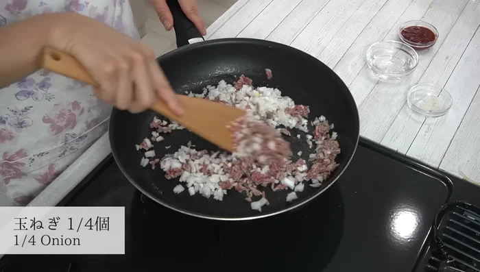 Add onions and a pinch of salt, stir-fry until cooked.
