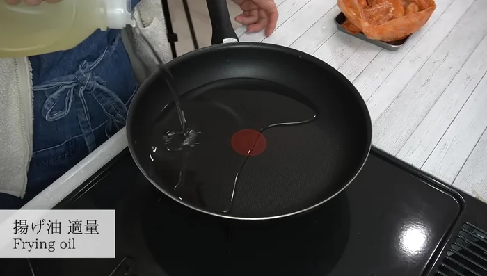 Heat about 1 cm of oil in a frying pan to approximately 160°C (check by adding a small piece of chicken and looking for slow bubbles).