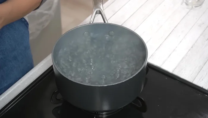 Boil eggs with salt (prevents white from spreading if shell cracks) for 12 minutes.