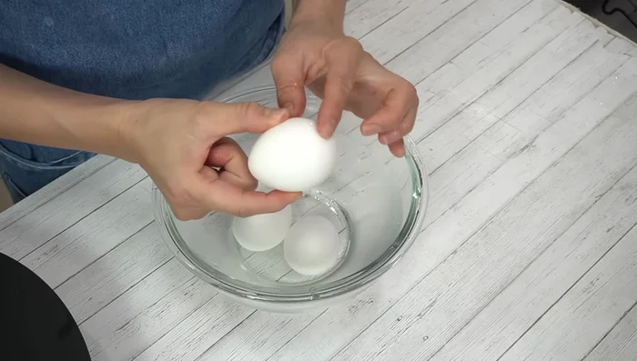 Peel the eggs and separate the yolks from the whites.