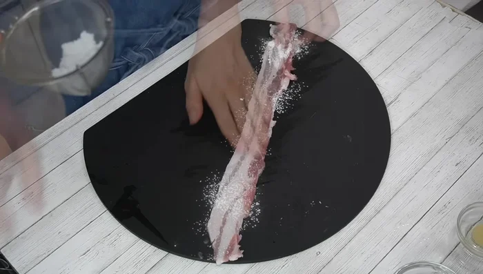 Prepare pork belly: Lightly coat thin pork belly slices with potato starch. Roll up tightly from one end, ensuring the end faces down. Repeat with remaining slices.