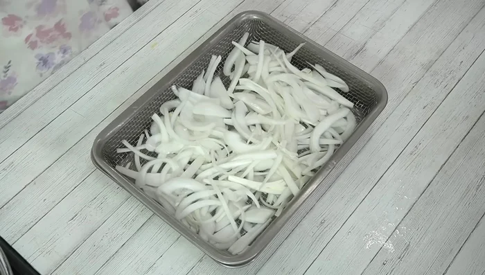 After 30 minutes, add the prepared dressing to the onions and toss gently to coat.