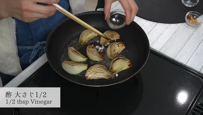 Add sugar, mirin, vinegar, and soy sauce to the pan. Return the garlic and mix well. Simmer briefly to blend flavors.