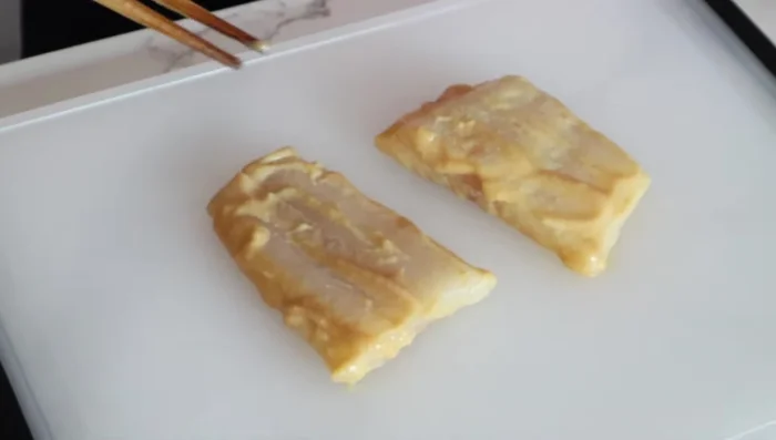 Thoroughly wipe off the miso mixture from the cod to prevent burning during cooking.