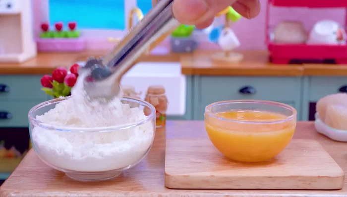 Bread the puffer fish with flour, egg, and Cheetos.