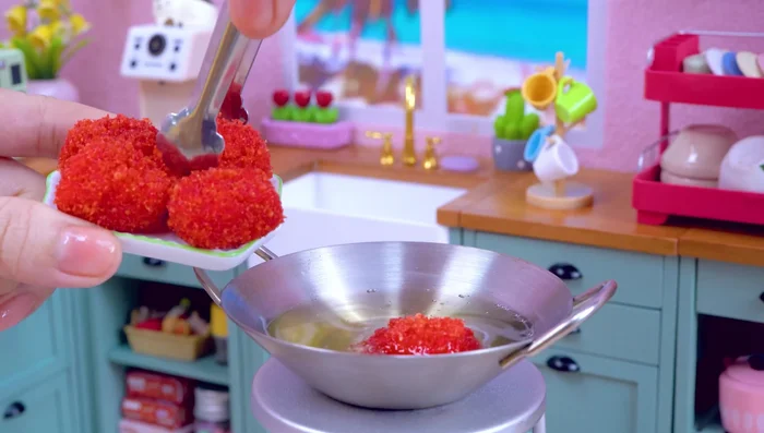 Fry the breaded puffer fish.