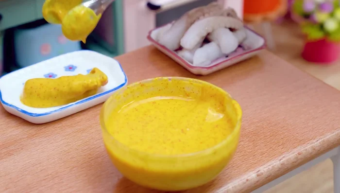 Coat the octopus in batter. Dip the octopus into the batter mixture.