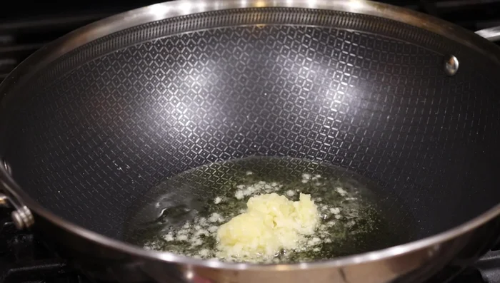 Prepare the rice: Heat avocado oil in a pan, add minced garlic and cook lightly until light brown. Add rice and tamari or soy sauce, cook until heated through. (297.36)