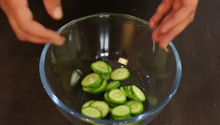Dice mini cucumbers thinly and heavily salt them in a bowl to extract water. Rinse and set aside. (74.56)