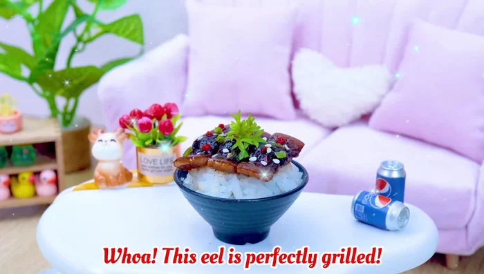Serve: Place the grilled eel on a bed of rice and sprinkle with sesame seeds.