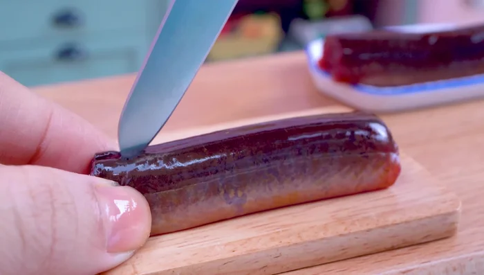 Clean and prepare the eel: Remove the bones and cut it into halves.