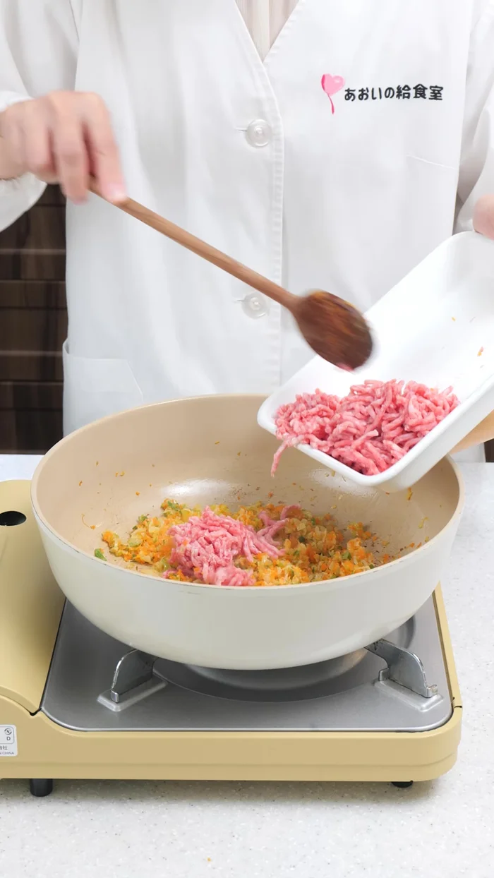 Add the minced tofu and stir fry until it changes color.