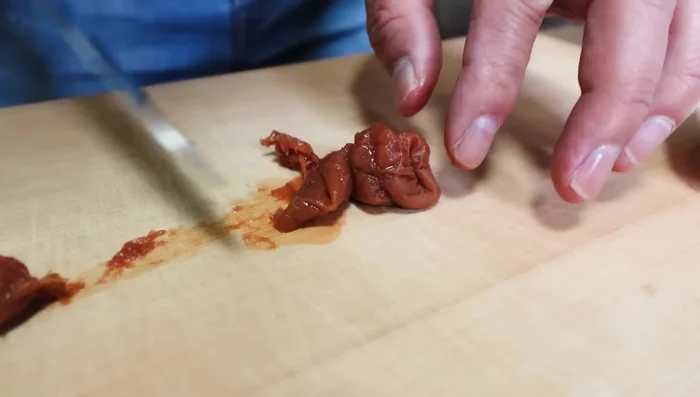 Prepare Umeboshi plum paste (optional): Remove seeds from umeboshi plums, chop, and mash into a paste.
