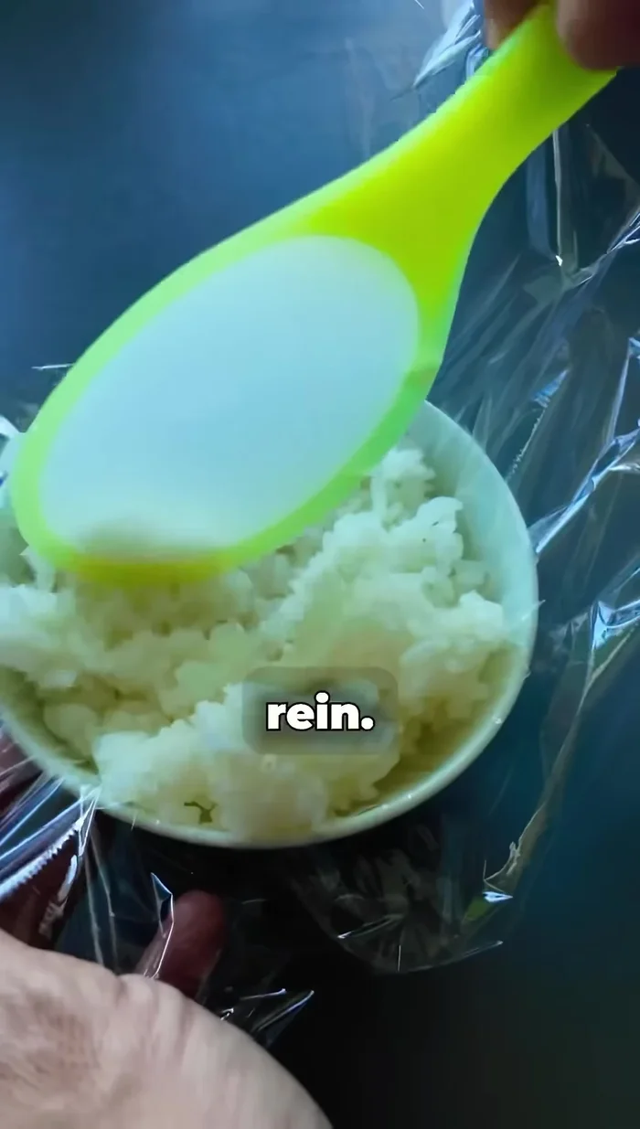 Fill the rice balls with the tuna mixture.