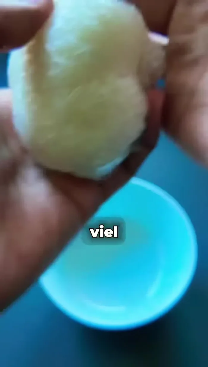 Shape the filled rice into a triangular shape, avoiding pressing too hard.