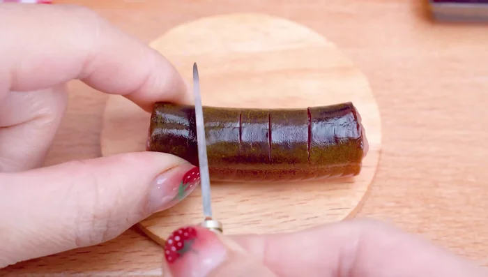 Prepare the eel: Score the eel's body. Add it to the sauce tray.