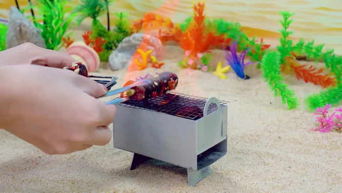 Place the eel on the charcoal grill. Flip it over. Brush the eel with unagi sauce.