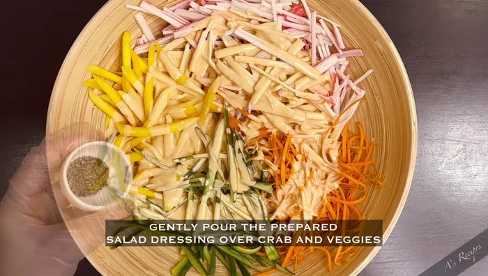 Add black pepper and toss everything evenly to coat the salad with the dressing.