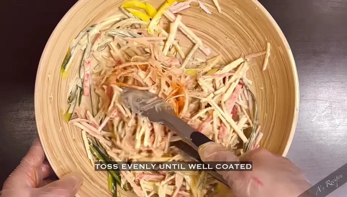 Add chopped green onions and sprinkle with toasted sesame seeds.