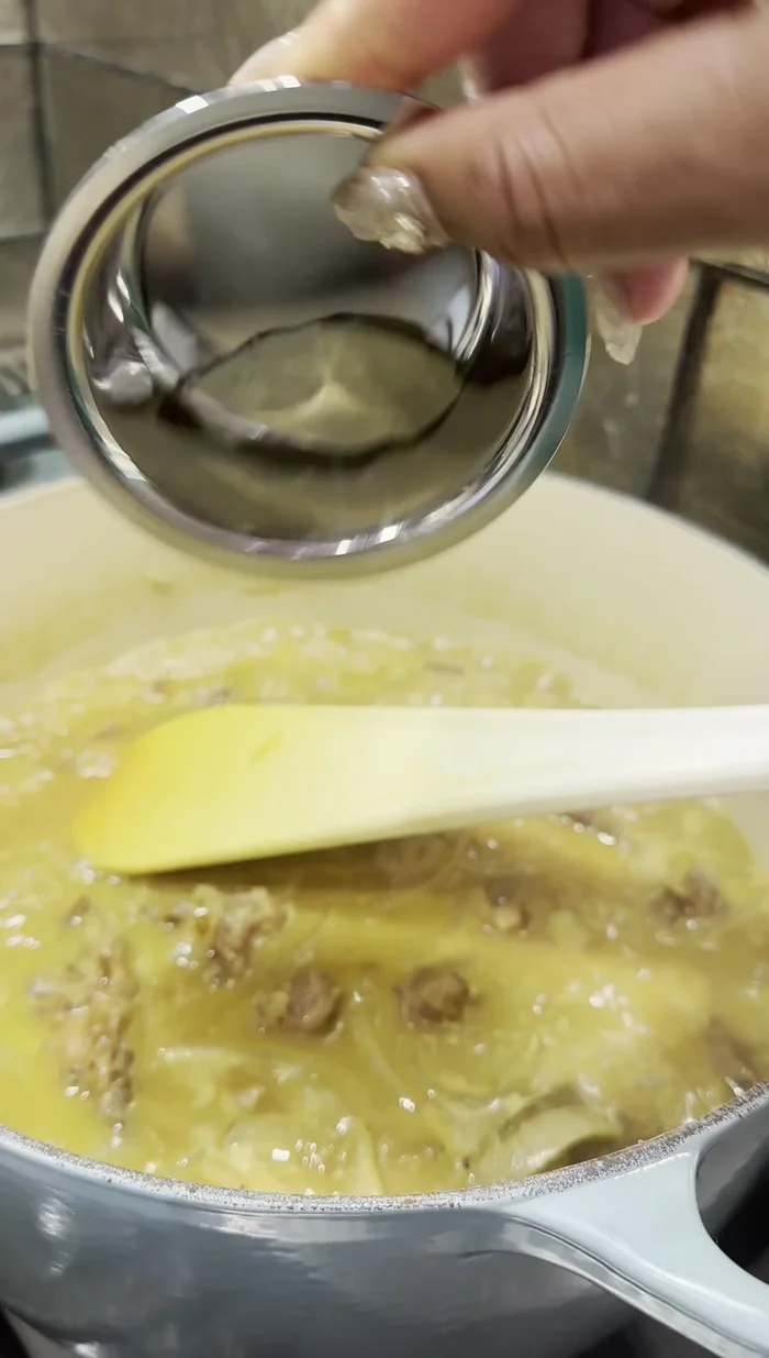 Add milk, Worcestershire sauce, bay leaf, mushrooms, grated apple, potatoes, and carrots. Stir.