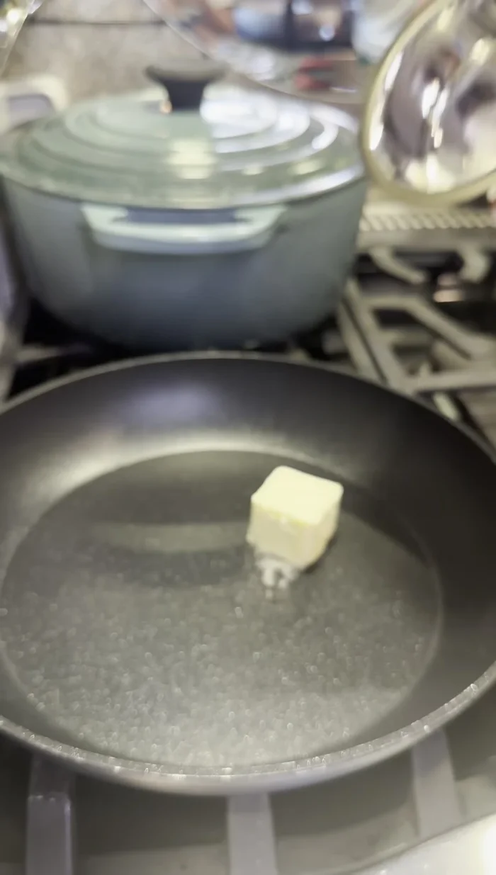 Sauté two large onions in butter and oil until golden brown (medium to low heat).