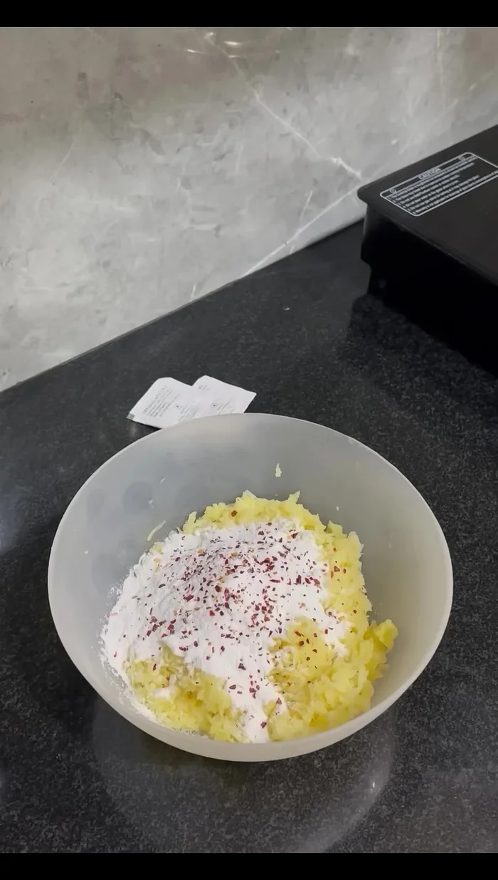 Mix in rice flour, chilli flakes, oregano, pizza seasoning (optional), and salt to taste.