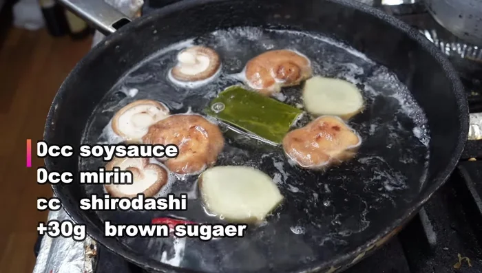 Add shitake mushrooms and mirin.