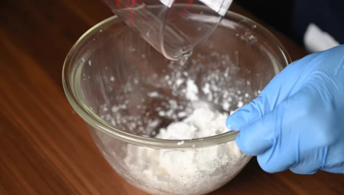 Knead the dough: Press the dough into a bowl. Knead until smooth and elastic, adding a little more water if needed. The dough should have the texture of an earlobe.