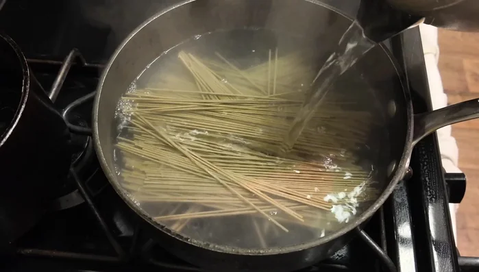 Cook dried soba noodles in boiling water for 6 minutes, drain, and rinse with cold water.