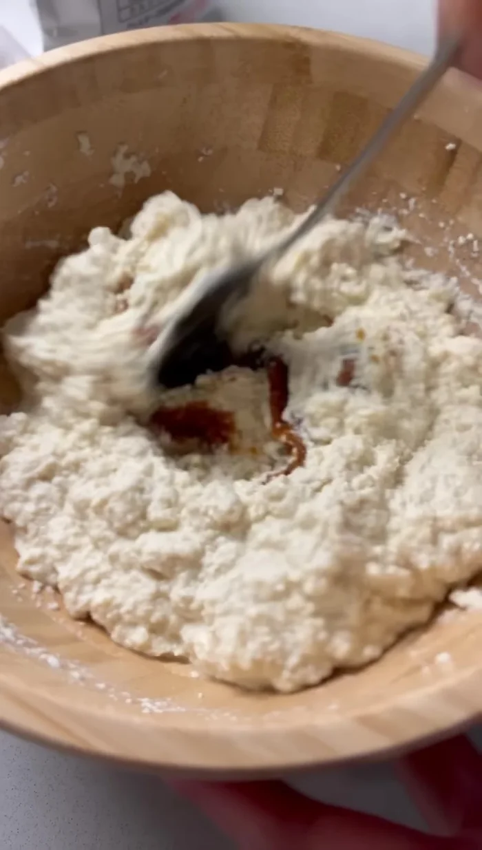 Add a tablespoon of miso paste to the mashed tofu and mix well.
