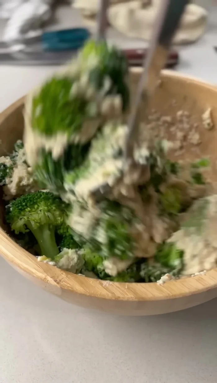 Add the steamed broccoli to the tofu mixture.