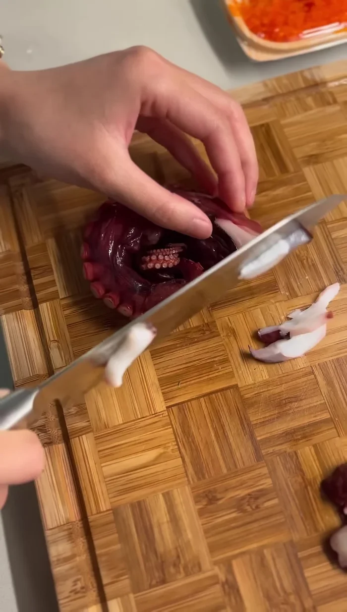 Slice taco (or octopus) into thin cuts and add to the salad.
