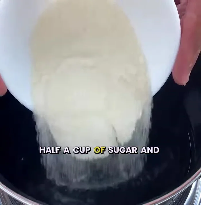In a saucepan, combine 1/2 glass of water, 1/2 glass of rice vinegar, and 1/2 cup of sugar. Heat for 5 minutes until the sugar dissolves.