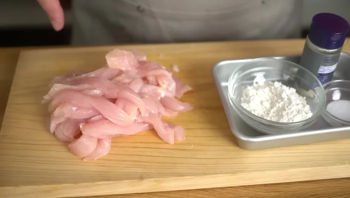 Coat the chicken strips in flour, salt, and pepper. A bag is useful for this step.