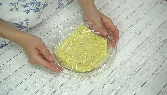 Microwave the noodles: Place yakisoba noodles on a heat-resistant plate, loosely cover with plastic wrap, and microwave at 600W for 50 seconds to soften them.