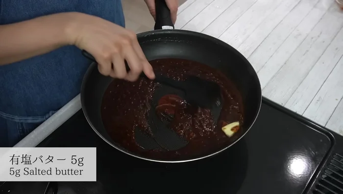 Add butter to the sauce and melt. Pour the sauce over the cooked hamburger steaks.