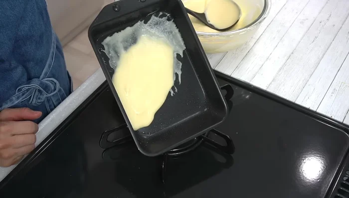Pour a thin layer of batter into the hot pan, spread evenly, and bake until browned. Add a little water or milk if batter becomes too thick.