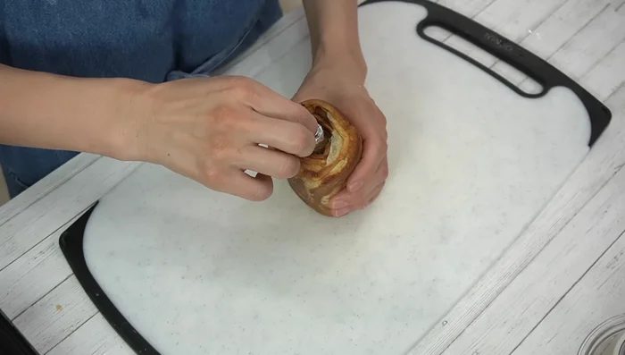 Remove the aluminum foil tube and slice the Baumkuchen to your desired width.