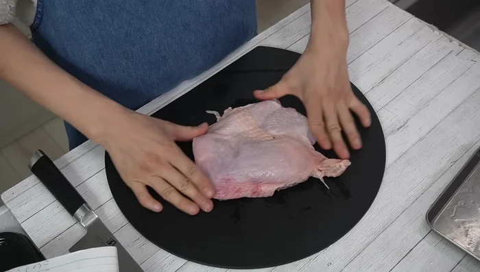 Remove excess skin from the chicken.